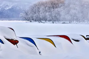 Asia, Japan, Hokkaido, Lake Kussharo, Colorful Canoes in the Snow