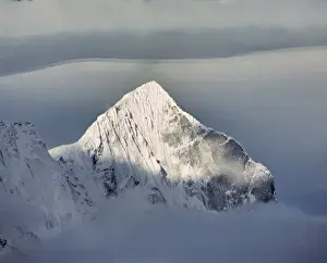 Asia, Nepal, Sagarmatha NP. Clouds loft above Kwangde Peak in Sagarmatha NP, a World Heritage Site