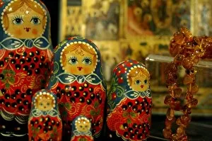 Asia, Russia. Typical Russian handicrafts. Traditional Matrushka (nesting) dolls & amber necklace