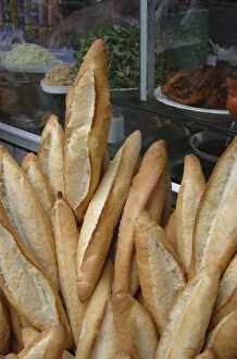 Images Dated 24th January 2006: Asia, Vietnam. Baguettes for sale at a local store, Hoi An, Quang Nam Province