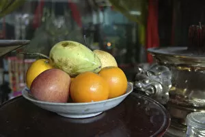 Asia, Vietnam. Fresh fruit in a bowl, Quan Congs Temple, Hoi An, Quang Nam Province