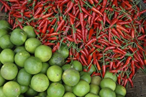 Asia, Vietnam. Limes and chili peppers for sale at the Dong Ba Market, Hue, Thua