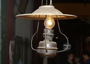 Vietnam Prints: Asia, Vietnam. Old kerosene lamp converted to electricity, Quan Congs Temple