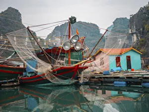 Vietnam Prints: Asia, Vietnam, Quang Ninh, Ha Long Bay. Colorful fishing boat at its dock is reflected