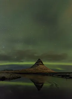 Images Dated 26th January 2017: Aurora borealis reflects below Kirkjufell aka Church Mountain on the Snaefellsnes