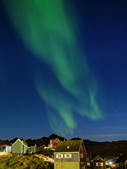 Aurora Prints: Aurora over the town. Town Tasiilaq (former Ammassalik)