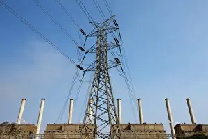 Australia, Victoria, High tension wires and power pylon in front of coal-fired Hazelwood
