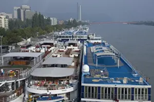 Riverboat Prints: Austria, Vienna. Riverboats docked side by side along the Danube River