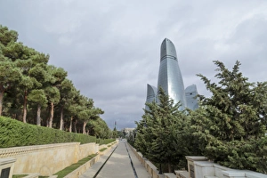 Baku Prints: Azerbaijan, Baku. A walkway in Dagustu park, with the Flame Towers in the background