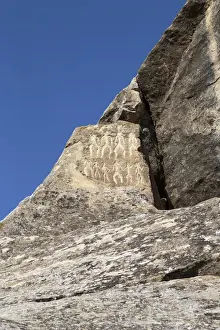 Caspian Sea Prints: Azerbaijan, Qobustan. Petroglyphs of people carved into a stone at Gobustan National Park