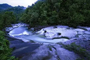 Queensland Prints: The Babinda Boulders is a fast-flowing river surrounded by smooth boulders and a