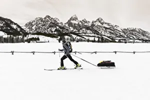 Backcountry skier under the Tetons, Grand Teton National Park, Wyoming USA