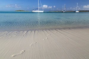 Images Dated 10th April 2015: Bahamas, Exuma Island, Cays Land and Sea Park. Sand footprints and moored sailboats