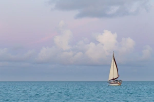 Bahamas Prints: Bahamas, Exuma Island. Sailboat at sunset