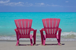 Plastic Prints: Bahamas, Little Exuma Island. Pink chairs on beach