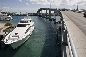 Paradise Island Prints: Bahamas, Paradise Island, Yacht moored under Paradise Island Bridge near Atlantis Resort