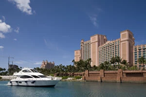 Bahamas, Paradise Island, Yacht motors into marina at Atlantis Resort