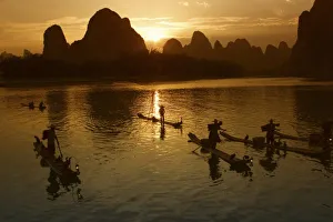 Yangshuo Prints: Bamboo rafts on the Li River at sunset, Yangshuo, Guangxi Province, China