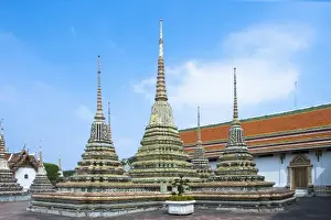 Inti St Clair Prints: Bangkok, Thailand - Three ground-level spires featured prominently within a Buddhist temple