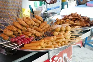 Inti St Clair Prints: Bangkok, Thailand - Selection of delicious looking fried foods for sale at a street
