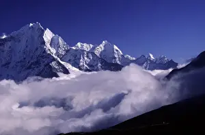 Himalaya Prints: A bank of heavy clouds rolls up the Gokyo Valley underneath high Himalayan peaks