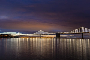 Images Dated 21st April 2016: The Bay Bridge reflects at dawn in San Francisco, California, USA