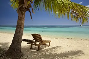 Beach, palm trees and lounger, Plantation Island Resort, Malolo Lailai Island, Mamanuca Islands