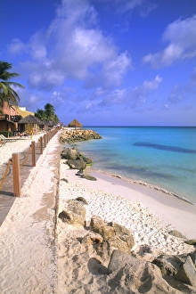 Beach and Rocks of colorful Divi Tamaarian Resort in Aruba