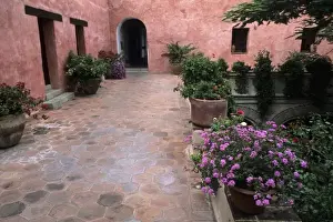 Court Yard Prints: Beautiful colors of Mexico Architecture stucco with flowers and arches in Oaxaca Mexico