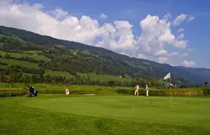 Beautiful golf with golfers at the #18 hole at exclusive Golf Club Murau Kreischberg