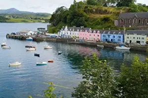 Beautiful port and sailboats with reflections in small tourist village of Portree