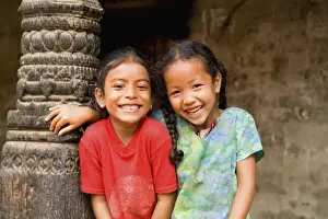 Children Prints: Beautiful young children laughing aged 6 and 7 having fun in village of Bhaktapur