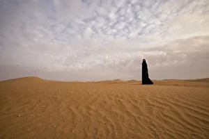 Bedouin woman in the desert. Abu Dhabi, United Arab Emirates