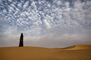 Land Prints: Bedouin woman in the desert. Abu Dhabi, UAE
