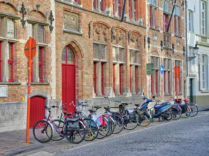 Bicycle Prints: Belgium, Brugge. Bicycles parked along the street