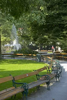 Empty benches in the Rathauspark (Vienna City Hall Park), Vienna, Austria