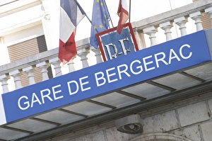 Images Dated 20th November 2005: The Bergerac train station. Detail of the sign and the French flags. Bergerac Dordogne