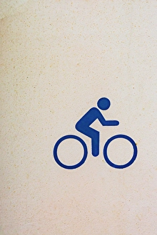 Sport Prints: Bicycler icon painted on wall, USA