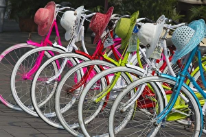 Indonesian Prints: Bicycles and colorful straw hats on the street, Jakarta, Indonesia