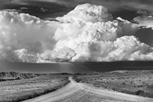 Gravel Road Prints: Billowing storm clouds along East Powder River Road in Powder River County, Montana, USA