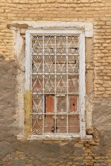 Tunisia Prints: Bir Al Huffay, Sidi Bouzid, Tunisia. Decorative barred window on a brick building