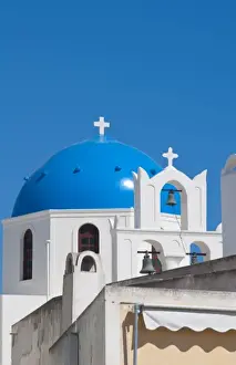 Prints of Blue domb church of beautiful Oia in Greek Island of Santorini Greece on cliffs on holiday Images Dated 2028 September: Blue domb church of beautiful Oia in Greek Island of Santorini Greece on cliffs