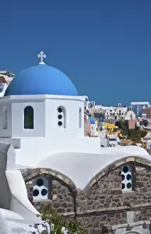Images Dated 2028: Blue domb church of beautiful Oia in Greek Island of Santorini Greece on cliffs