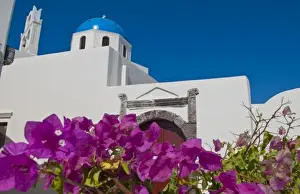 Prints of Blue domb church of beautiful Oia in Greek Island of Santorini Greece on cliffs on holiday Images Dated 2028 September: Blue domb church of beautiful Oia in Greek Island of Santorini Greece on cliffs