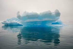 Blue iceberg in the fjord of Narsarsuaq, Greenland
