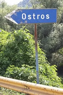 Images Dated 9th July 2006: Blue rusty Road side sign pointing left saying Ostros. Near Dupilo, Golubovic Montenegro