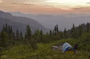 Blue tent and a vew of the North Cascade Mountains from the Tatoosh Wilderness adjacent to Mt