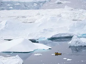 Boat at Ilulissat Icefjord, a UNESCO World Heritage Site, also called kangia or Ilulissat
