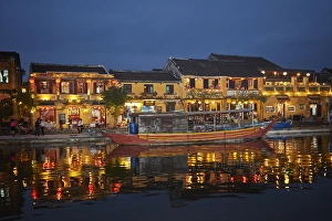 Thu Bon River Prints: Boat and restaurants reflected in Thu Bon River at dusk