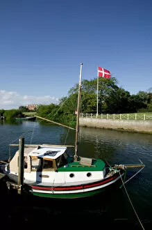 Boat tied up at wharf on Ribe River, Ribe, Jutland, Denmark